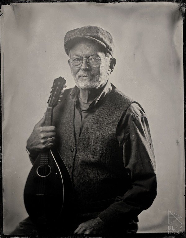 Steve Maxwell of the Fat Chance Jug Band, in a sepia photo.